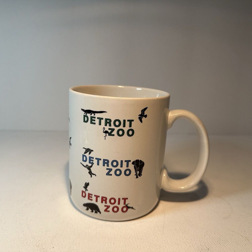 Detroit Zoo Mug, White w/Multi-Color Repeating Text, Black Animal Silhouettes